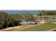 Golf course view with a water feature, bridge, and sand traps, offering both beauty and challenging play at 3300 Cove Cay Dr # 6G, Clearwater, FL 33760