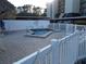 Community hot tub area with ample seating, perfect for relaxation and socializing with neighbors at 3300 Cove Cay Dr # 6G, Clearwater, FL 33760