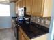 Kitchen with granite countertops and wood cabinets at 3300 Cove Cay Dr # 6G, Clearwater, FL 33760