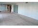 Spacious living room featuring large mirrors, light blue walls, and plush carpeting at 3300 Cove Cay Dr # 6G, Clearwater, FL 33760