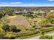 Expansive aerial view of a community park with a baseball field and walking paths at 3310 Carib Rd, Tampa, FL 33618