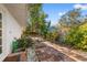 Landscaped backyard with garden pathway and verdant plants at 3310 Carib Rd, Tampa, FL 33618