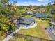 Aerial view of the community park, with covered seating, grassy areas, and views of the nearby lake at 3310 Carib Rd, Tampa, FL 33618