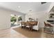 Dining room featuring a chandelier, neutral colors, and sliding glass doors with a view of the backyard at 3310 Carib Rd, Tampa, FL 33618