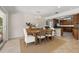 Elegant dining area with a chandelier and a view of the well-equipped kitchen at 3310 Carib Rd, Tampa, FL 33618