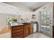 Kitchen island with a breakfast bar and granite countertops, leading into the dining area at 3310 Carib Rd, Tampa, FL 33618