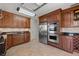 Spacious kitchen with stainless steel appliances, custom cabinets, and tile backsplash at 3310 Carib Rd, Tampa, FL 33618