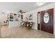 Inviting living room with a decorative front door and stylish built-in shelving at 3310 Carib Rd, Tampa, FL 33618