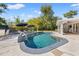 Refreshing private pool with poolside seating and lush backyard landscaping at 3310 Carib Rd, Tampa, FL 33618