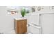 Bright bathroom featuring a wood vanity, white counter, and brushed nickel faucet at 3499 43Rd N St, St Petersburg, FL 33713