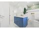 Bright bathroom featuring blue vanity and modern golden faucet at 3499 43Rd N St, St Petersburg, FL 33713