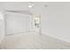 Bright bedroom with light wood flooring, white walls, and a large closet at 3499 43Rd N St, St Petersburg, FL 33713