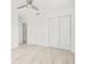 Bright bedroom featuring wood floors, a ceiling fan and closet at 3499 43Rd N St, St Petersburg, FL 33713