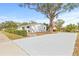 A well-kept home with a large, paved driveway and mature landscaping at 3499 43Rd N St, St Petersburg, FL 33713