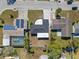 Aerial view of home with solar panels and pool at 3547 Garfield Dr, Holiday, FL 34691