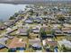 Aerial view of home and neighborhood by the water at 3547 Garfield Dr, Holiday, FL 34691