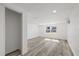 Sunlit bedroom with wood-look floors and window at 3547 Garfield Dr, Holiday, FL 34691