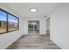 Dining room with sliding glass doors and wood-look floors at 3547 Garfield Dr, Holiday, FL 34691