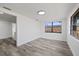 Bright dining room with wood-look floors and large windows at 3547 Garfield Dr, Holiday, FL 34691