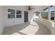 Front porch with ceiling fan, offering curb appeal at 3547 Garfield Dr, Holiday, FL 34691