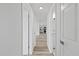 Clean hallway with doors to bedrooms and kitchen at 3547 Garfield Dr, Holiday, FL 34691