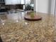 Close up of a granite kitchen island featuring decorative accents at 3829 Biscay Pl, Land O Lakes, FL 34639