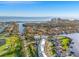 Aerial view of Pelican Isle neighborhood with waterfront homes and a cityscape backdrop at 3903 Sand Dollar Pl, Tampa, FL 33634