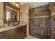 Modern bathroom showcasing a custom shower and decorative stone accents at 3903 Sand Dollar Pl, Tampa, FL 33634