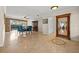 Elegant dining room with travertine flooring, large picture window, and classic furniture at 3903 Sand Dollar Pl, Tampa, FL 33634