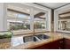 Close up of the sink showing granite countertops and view to pool at 3903 Sand Dollar Pl, Tampa, FL 33634