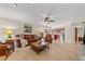 Comfortable living room with leather furniture, tile flooring, and open layout to the kitchen at 3903 Sand Dollar Pl, Tampa, FL 33634