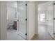 Modern bathroom with white vanity, grey tile, and a walk-in shower at 409 E Adalee St, Tampa, FL 33603