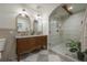 Elegant bathroom with double vanity, large shower, and marble countertops at 409 E Adalee St, Tampa, FL 33603