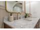 Double vanity with marble countertop and gold fixtures at 409 E Adalee St, Tampa, FL 33603