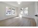 Spacious bedroom with light hardwood floors and bright windows at 409 E Adalee St, Tampa, FL 33603