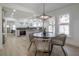 Bright dining area with round table and woven chairs, open to kitchen at 409 E Adalee St, Tampa, FL 33603