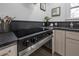 Sleek kitchen features a modern stovetop and dark countertops at 409 E Adalee St, Tampa, FL 33603