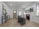 Living room with hardwood floors, fireplace and entryway view at 409 E Adalee St, Tampa, FL 33603