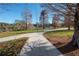 A paved pathway next to a lake in a park setting at 409 E Adalee St, Tampa, FL 33603