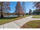 Paved walkway beside a lake with fall foliage trees at 409 E Adalee St, Tampa, FL 33603