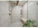 Spacious walk-in shower with built-in seating and shelves at 409 E Adalee St, Tampa, FL 33603