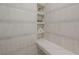 Walk-in shower with built-in shelves and marble seat at 409 E Adalee St, Tampa, FL 33603