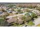 Aerial view of homes in a well-established neighborhood with mature trees and landscaping at 4210 Revere Cir, New Port Richey, FL 34653