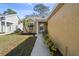 Inviting front entrance with a well-lit walkway, cozy seating area and a storm door for added security at 4210 Revere Cir, New Port Richey, FL 34653