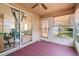 Enclosed sunroom with windows, a ceiling fan, and access to the outdoors at 4210 Revere Cir, New Port Richey, FL 34653