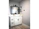 Bathroom featuring a modern vanity with a sink, mirror, and sleek fixtures at 4645 Commodore Ave, Spring Hill, FL 34606