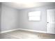 Bright bedroom with neutral paint and updated flooring at 4645 Commodore Ave, Spring Hill, FL 34606