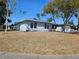 Charming single-story home featuring a well-maintained lawn, mature trees, and a two-car garage at 4645 Commodore Ave, Spring Hill, FL 34606