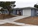 Ranch style home with gray siding and attached garage at 4645 Commodore Ave, Spring Hill, FL 34606