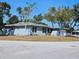 Charming single-story home featuring a well-maintained lawn, mature trees, and a two-car garage at 4645 Commodore Ave, Spring Hill, FL 34606